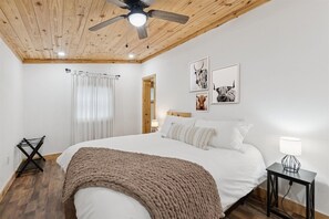 Bedroom Retreat: Bright, airy space with rustic charm, perfect for a restful getaway in the Smokies!

