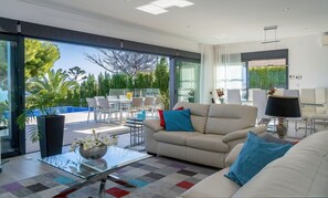 Spacious living area with sliding doors that open up completely 