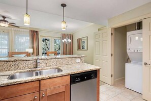 Full kitchen with stovetop, oven, microwave, dishwasher and washer/dryer.