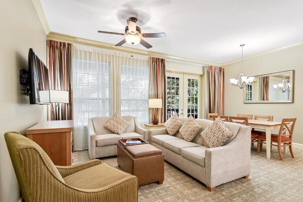 Spacious living room with fold out queen sofa bed.