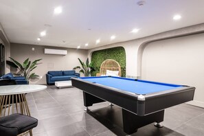 Pool table lounge area in basement 