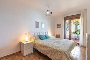 Comfortable and beautiful bedroom with double bed, exit to the balcony and storage area. (1)