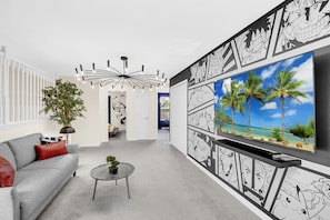 Sink into the inviting embrace of our living room, a haven of comfort and joy surrounded by the enchanting characters