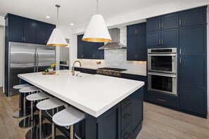 Oversized kitchen island and high end appliances for entertaining