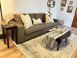 Comfy couch to read books at your lakeside Oasis