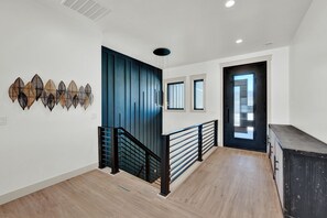 Front Door entry and stairs to the downstairs.
