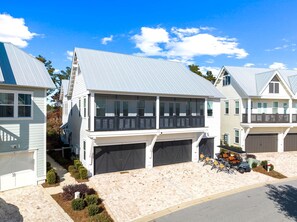 Home is on second floor with front side balcony.