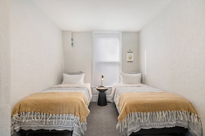 Our second bedroom features two stylish and comfortable twin beds
