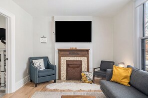 Dive into relaxation in our living room, featuring a large smart TV for your enjoyment!