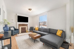 Unwind in style in our open living room with an inviting L-sectional!