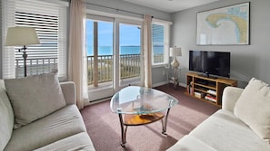 Comfortable living room with slider to balcony deck