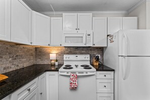 Kitchen with stovetop and microwave 