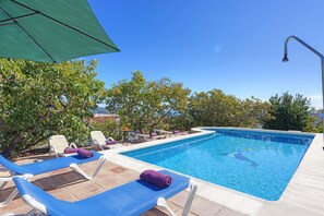 The inviting pool and sunloungers