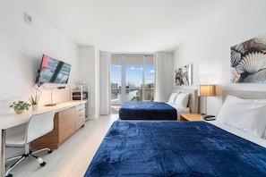Your waterfront retreat awaits! Our balcony provides front-row seats to boat activity, friendly manatees, and colorful fish, all beneath the sunset's warm glow. Sleep soundly on two full-sized beds.