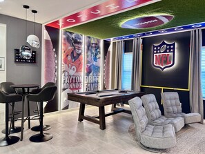 Our NFL-inspired loft: PlayStation 5 thrills and epic pool table fun!