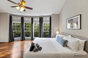 Main bedroom with ceiling fan.
