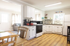 Light, open kitchen + dining area
