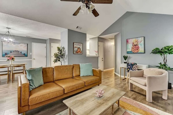 Living Room area with comfortable seating and a desk area for Work From Home!