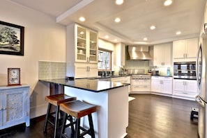 Step into modern culinary comfort in our cozy, updated kitchen. From sleek appliances to stylish finishes, every detail is designed to inspire your inner chef and create unforgettable moments around the table.