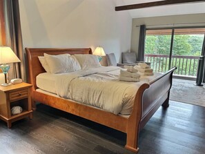 Experience the epitome of tranquility in our elegant wooden bed, perfectly positioned to face the breathtaking view of the mountains. Let the natural beauty outside your window inspire peaceful slumbers and unforgettable moments of serenity.