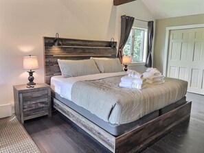 Unwind in luxury: Retreat to our spacious bedroom featuring a king-size bed, where comfort reigns supreme. From restful nights to lazy mornings, indulge in the ultimate relaxation in the heart of Killington.