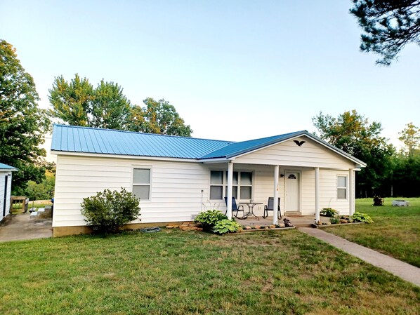 Front of house with porch and yard