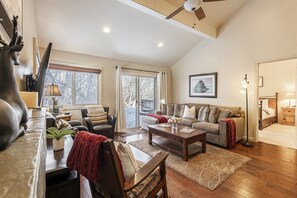 Living Room with Plush Furnishings, Smart TV, Gas Fireplace, and Patio Access with a Private Hot Tub