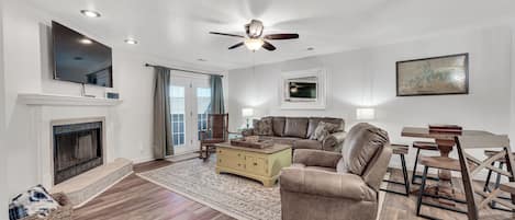The living room leads to the private back patio for extra living space