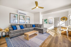 Spacious living room in the larger unit. 