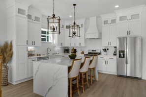 Gorgeous well appointed kitchen with oversized island.