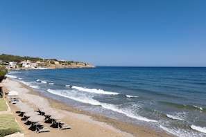 Enjoy the wonderful beach within a few steps, featuring sun beds for your use
