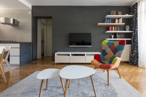 Living room with kitchen and dining area. Sofa can be pulled out in double bed.