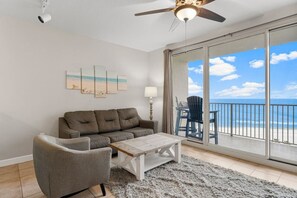 Living room with balcony access and gulf views!