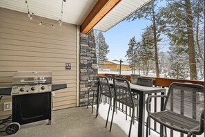 Private balcony with outdoor seating and a BBQ stocked with propane for your stay.
