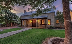 Our charming front house twinkling in the evening