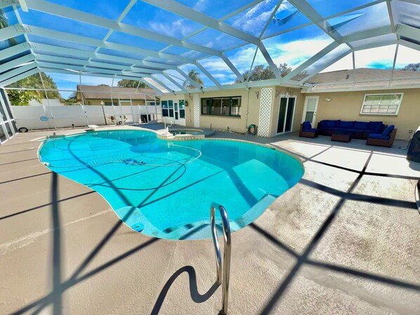 Welcoming pool & lanai with chase lounges, sectional, grill, etc