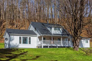 The house sits tucked away on the hillside but right in the heart of the village.