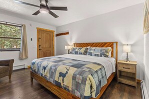 This room has a ceiling fan and a window to let in light.