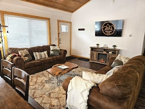 Relax on the sofa and watch a movie with the electric fireplace on!
