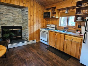 The kitchen and living space have an electric heater.