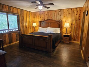 The comfortable King bed has a lovely wooden headboard.