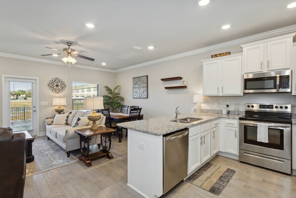 Enjoy open concept living, dining, and kitchen areas