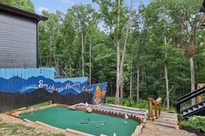 After having fun in the game room, how about playing some outdoor activities such as mini golf? Battle it out with each other and family to see who comes out on top in this stunning location amongst the trees and cabin vibes.