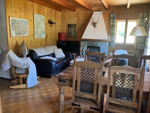 View of dining table and living room