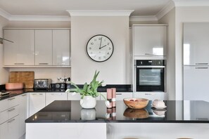 Large fully fitted kitchen with breakfast bar