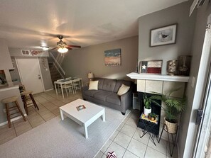 Welcome In to Sand Sun & Sea Getaway - living and dining areas on 1st floor