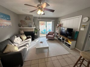 with a sleeper sofa, decorative fireplace