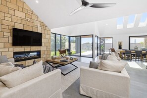 An electric log fireplace and TV