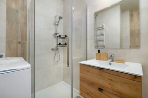 A cozy bathroom with a shower cabin.