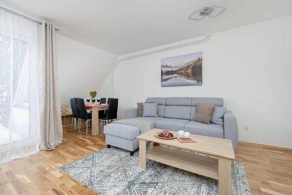 Comfortable living room with a corner double sofa bed.